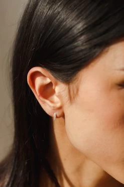 Olivia White Sapphire Huggie Hoops 16 Olivia White Sapphire Huggie Hoops -Gldn Shop 2023 03 NPL 0386