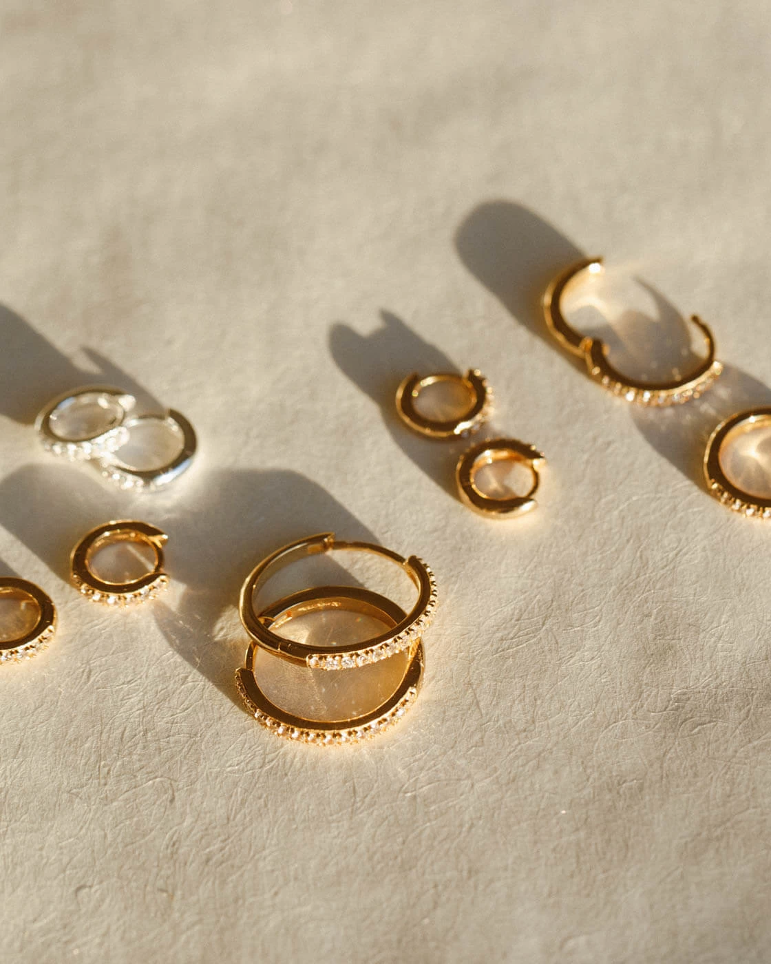 Olivia White Sapphire Huggie Hoops 10 Olivia White Sapphire Huggie Hoops - Image 8