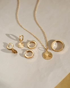 Radiant Charm Huggie Hoops -Gldn Shop GLD 7579 c6f8975b 8954 41c5 bab2 35c209b83f34