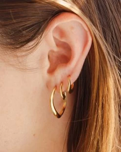 Flow Hoops -Gldn Shop bold gold sculptural hoops min 038317fd 16e4 4fe9 b7ee cec4e83ce4ce
